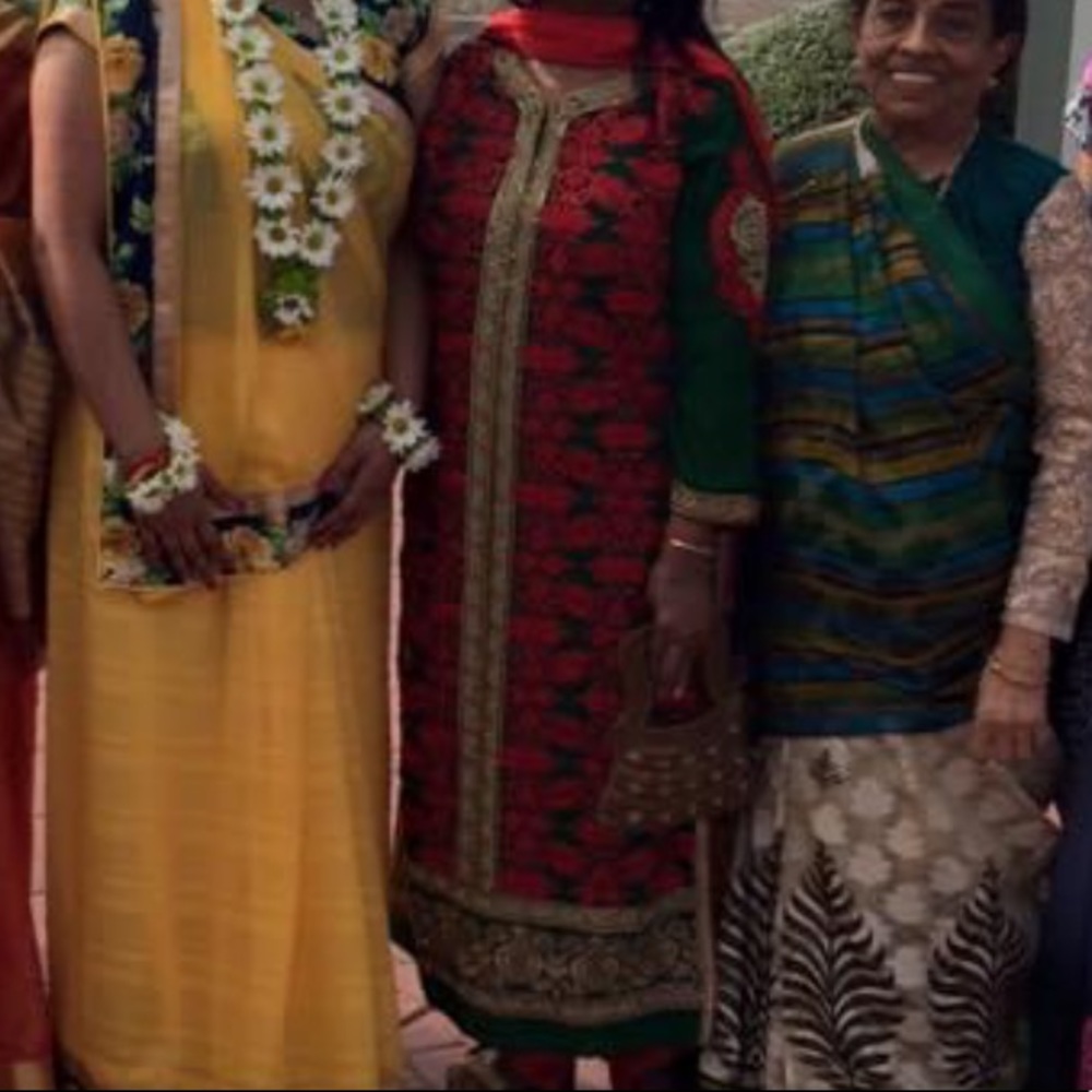 Red and green embroidered Indian suit